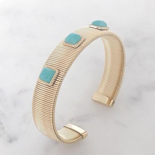 Bracelet semi ouvert doré en acier inoxydable orné de cabochons bleu turquoise